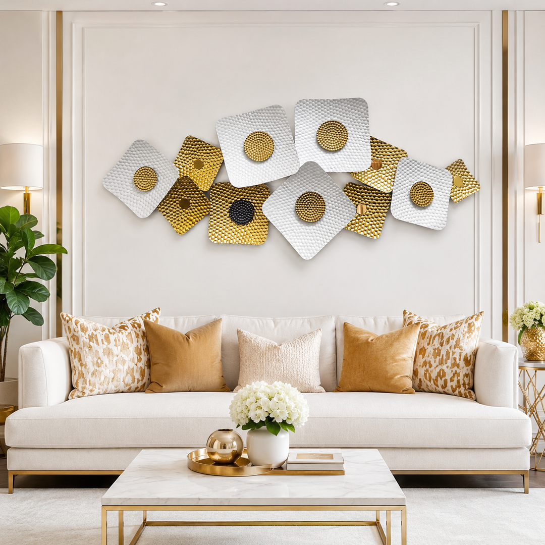 White and gold geometric metal wall sculpture above a sofa — Sona Casa