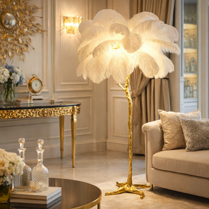 Ostrich feather LED floor lamp with a gold branch stand — Sona Casa