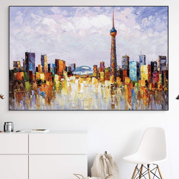 Colourful Toronto skyline canvas painting above a white sofa — Sona Casa