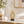 Gold abstract metal sculpture displayed on an entryway console